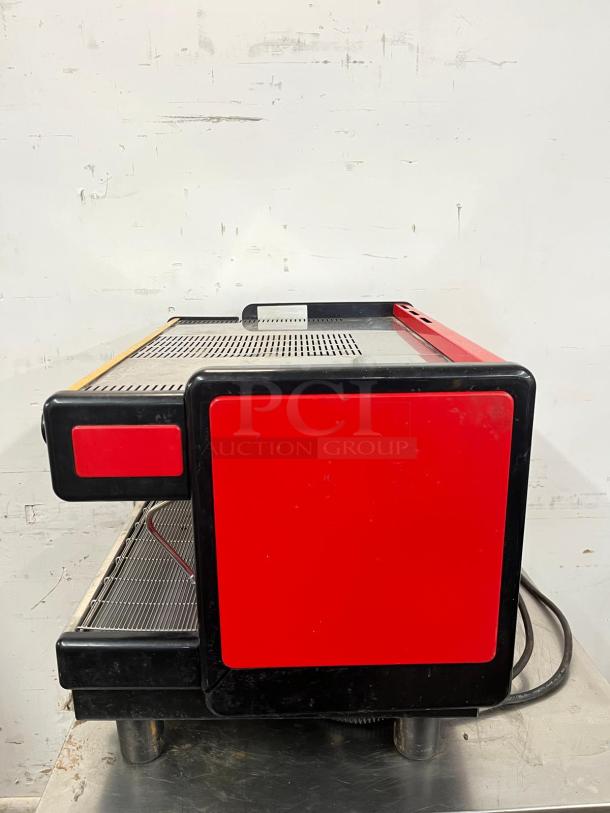 LA SPAZIALE NEW EK 2-group espresso machine, red and black finish, commercial use. Visible wear on metal surface.