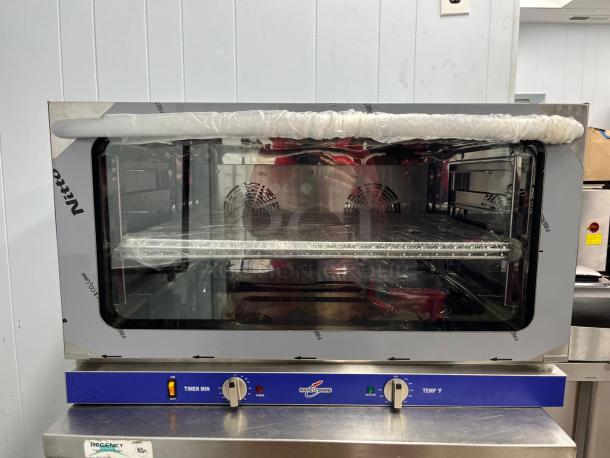 ROCKET ENCOV-38 countertop convection oven, full size, glass door, 208/204V, new condition with protective wrap.
