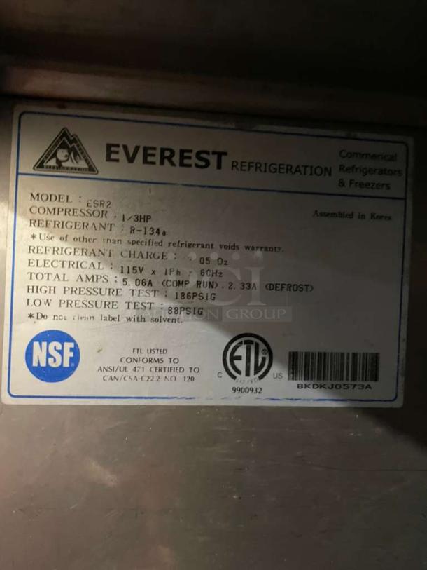 Label on Everest ESR Series commercial refrigerator detailing model ESR2, 115V, NSF certified, made in Korea.