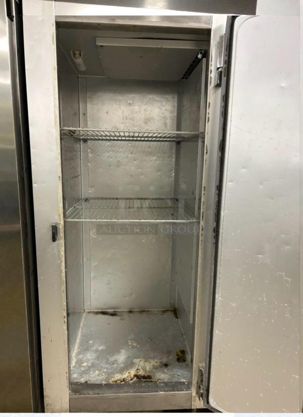 Traulsen G12010 commercial reach-in freezer, excellent condition, clean interior, stainless steel, two wire shelves, single door.