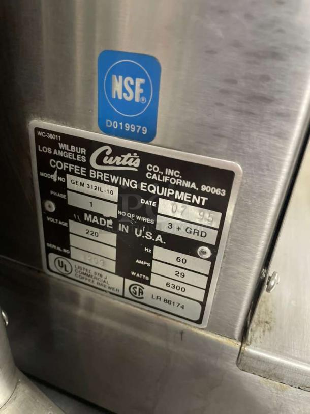 Wilbur Curtis GEM312IL commercial coffee brewer plate; NSF certified, model and serial numbers visible, in excellent condition.