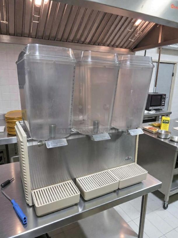 Crathco D35-4 triple bowl refrigerated beverage dispenser in exceptional condition, 115V, NSF & UL listed, fully operational.