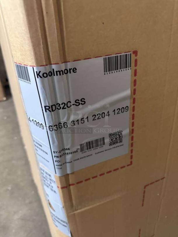 KoolMore RD32C-SS refrigerated display case packaging with visible labels showing brand and model. Brand new condition.