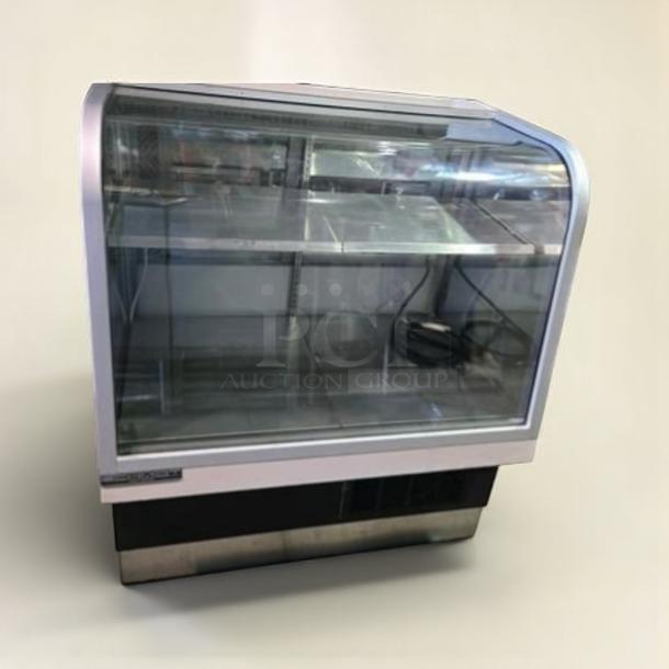 Impeccable C. Schmidt EHD-4 refrigerated deli display case with curved glass, 115V, fully tested, excellent condition.