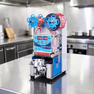 Outstanding condition ET-999SN tabletop cup sealing machine by Y-Fang. Automatic, commercial stainless steel, fully tested.