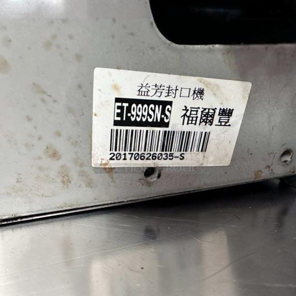 Stainless steel Y-Fang ET-999SN automatic cup sealing machine, outstanding condition, model label visible.