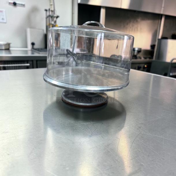 Acrylic cake display dome with stainless steel base, 12” diameter, commercial grade, premium condition.