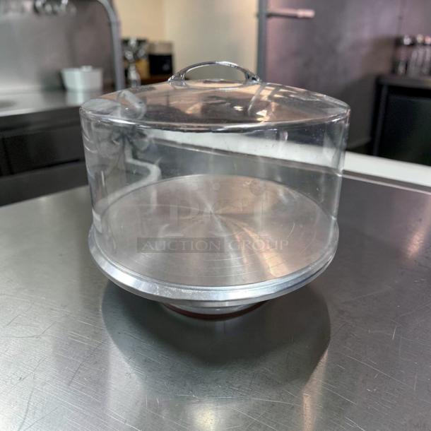 Premium condition acrylic cake display dome with stainless steel base, 12" diameter, commercial grade, ready for use.