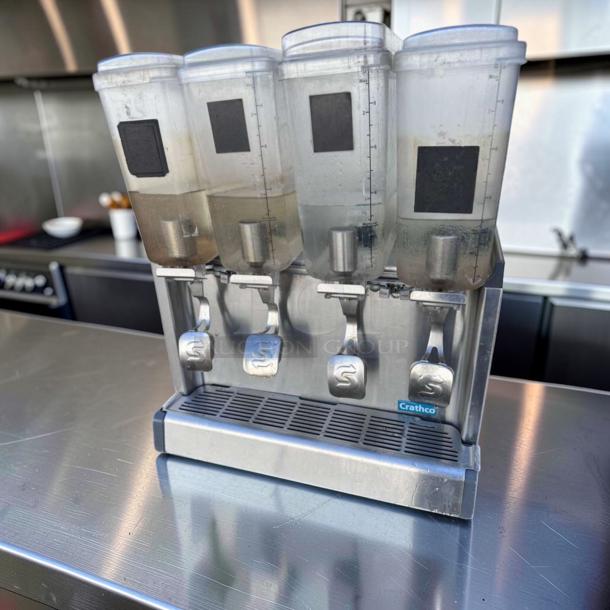 Crathco CS-4E-16-290 refrigerated drink dispenser with 4 bowls in superior condition. Fully tested, 120V, commercial use.