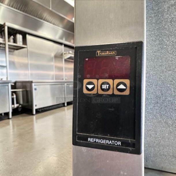 Traulsen G20010 commercial refrigerator control panel with temperature settings, stainless steel, fully operational.