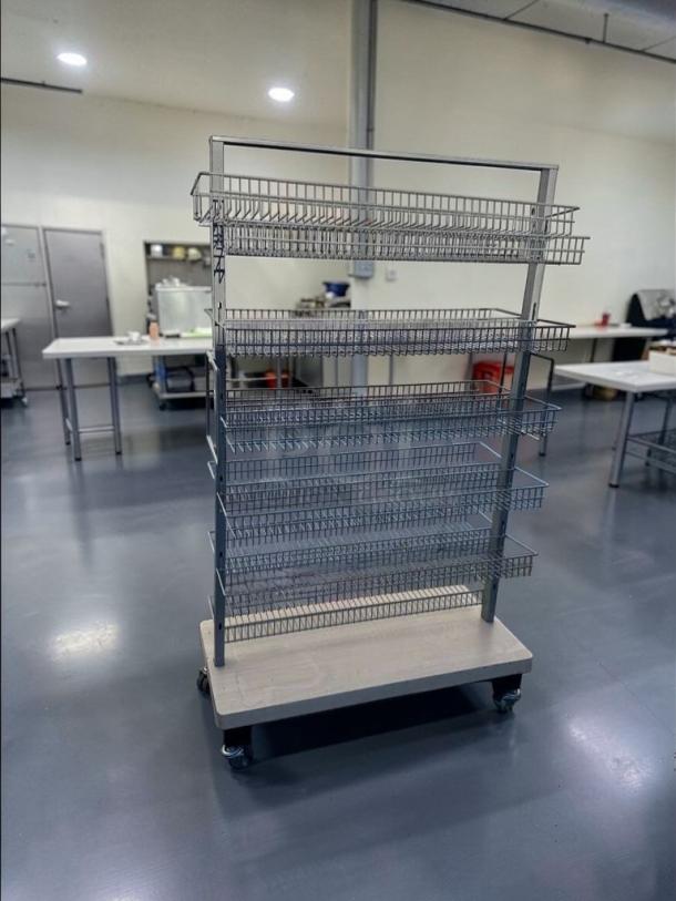 Commercial-grade multi-tier wire display rack in superior condition, heavy-duty construction, fully inspected, model RET-S-RACK-0581.
