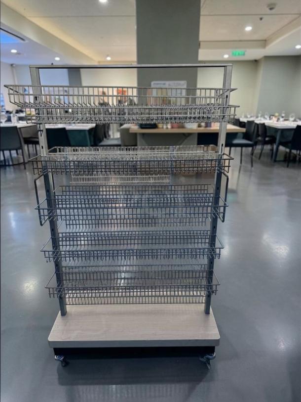 Commercial-grade multi-tier wire display rack, model RET-S-RACK-0581, in superior condition. Heavy-duty construction with rolling base, fully inspected.