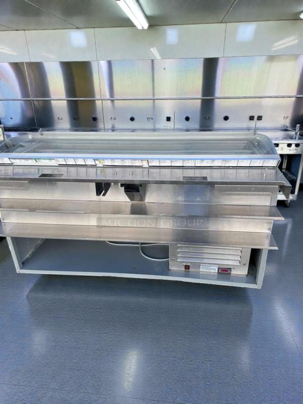 Commercial refrigerated deli display case with glass sneezeguard. Excellent condition, fully operational, model DEL-L-REF-0576.