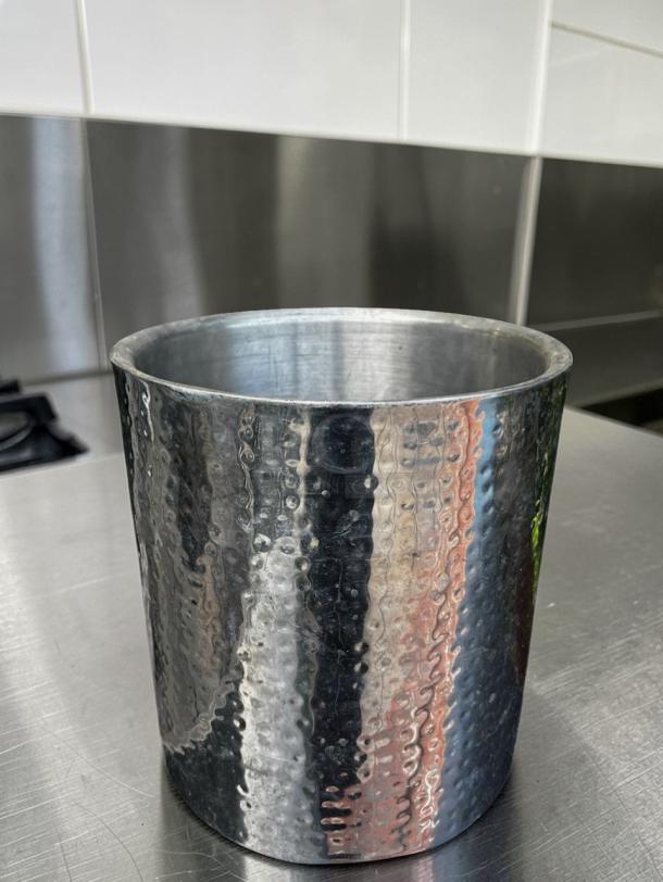 Hammered stainless steel ice bucket in immaculate condition, commercial grade. Model BAR-S-ICE-0663, ideal for bar service.