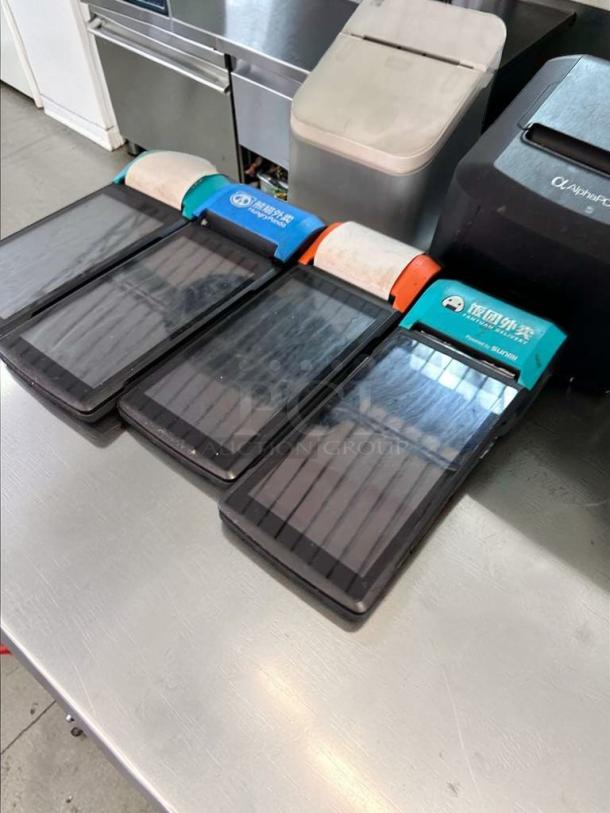 Set of 4 Sunmi V2 Wireless POS Terminals, outstanding condition, with built-in receipt printer for mobile ordering.