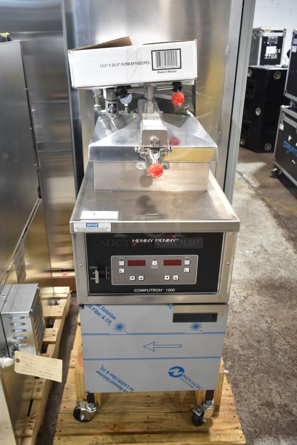 Brand new Henny Penny 500 commercial electric pressure fryer on casters. Features Computron 1000 controls. 220-240V, 1 phase.