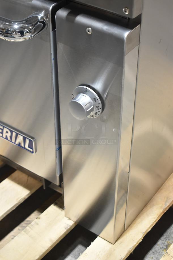 Brand new Imperial IR-6-E commercial electric range, 6 burners, oven, overshelf, backsplash, visible control knob.