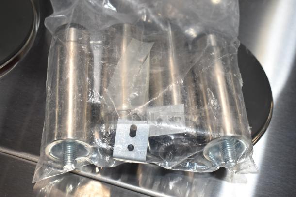 Bag with metal screws and parts, likely components for assembling the Imperial IR-6-E hot plate range.