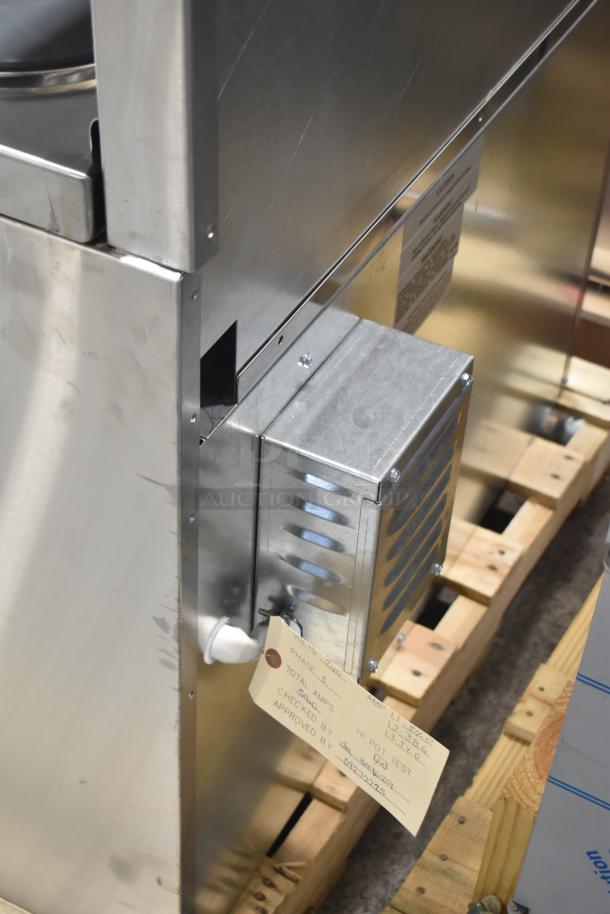 New Imperial IR-6-E commercial 6-burner range with oven. Features over shelf, back splash, 240V, 3-phase. Tag shows inspection details.