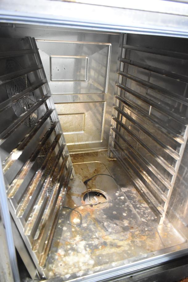 Interior of a 2021 Rational iCombi Pro Combi Convection Oven, showing multiple racks, visible wear, and residue build-up.