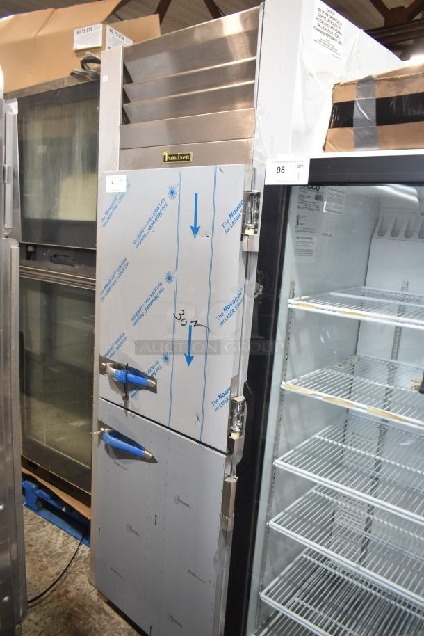 Brand new 2022 Traulsen G10042-032 2 half-door reach-in cooler with casters, 115V, 1 phase, minor scratches.