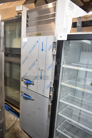 Brand new 2022 Traulsen G10042-032 2 half-door reach-in cooler with casters, 115V, 1 phase, minor scratches.