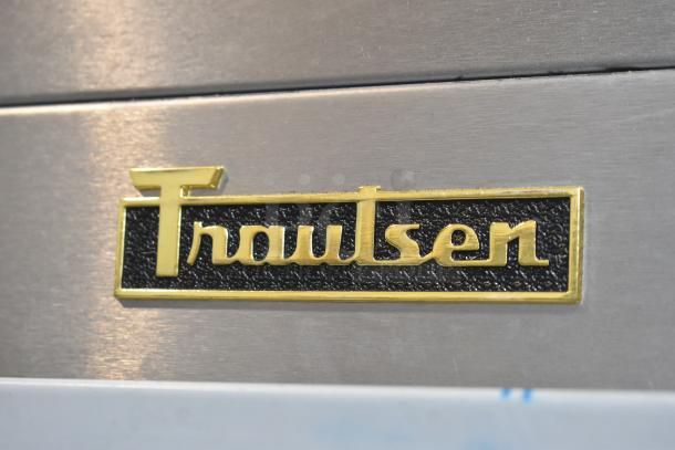 Traulsen logo on the 2022 G10042-032 Reach-In Cooler, commercial-grade, 2 half-size doors, includes casters.