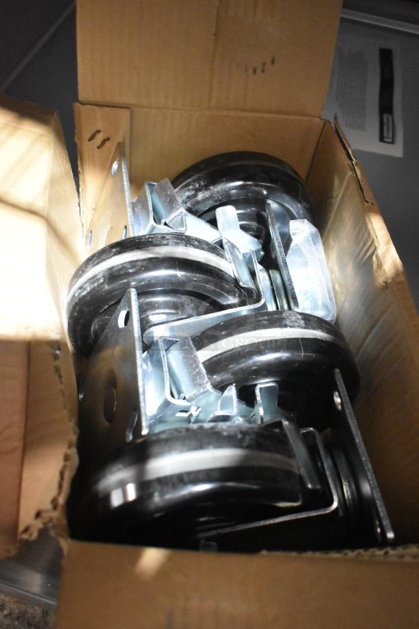 Box of commercial casters for 2022 Traulsen G10042-032 reach-in cooler, appearing new.