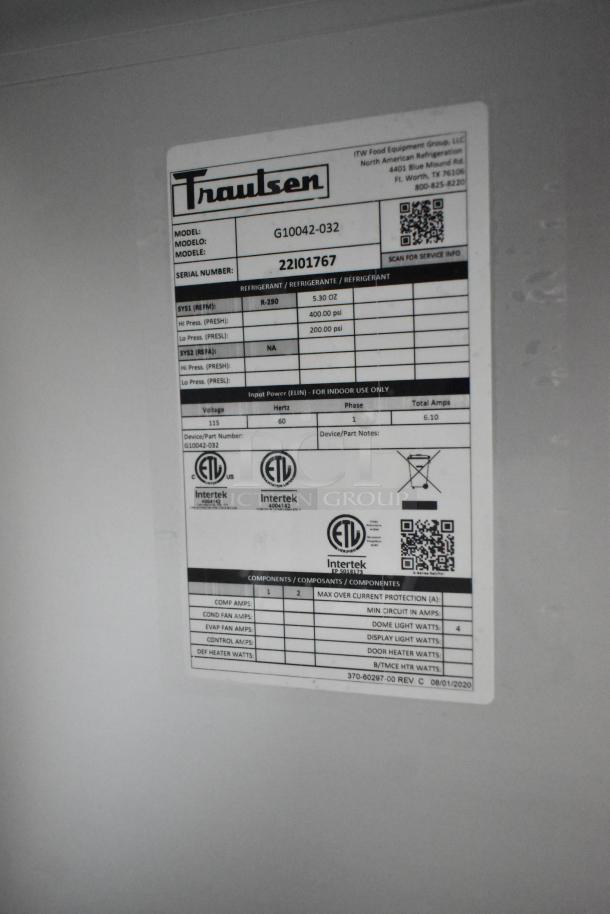 Label on brand new 2022 Traulsen G10042-032 commercial reach-in cooler. Features: 2 half doors, 115V, includes casters.