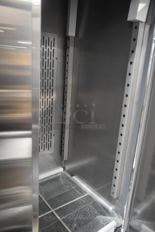 Brand new 2025 Avantco 178SS3FHC commercial 3-door reach-in cooler interior, 115 volts, 1 phase, showing shelving slots.