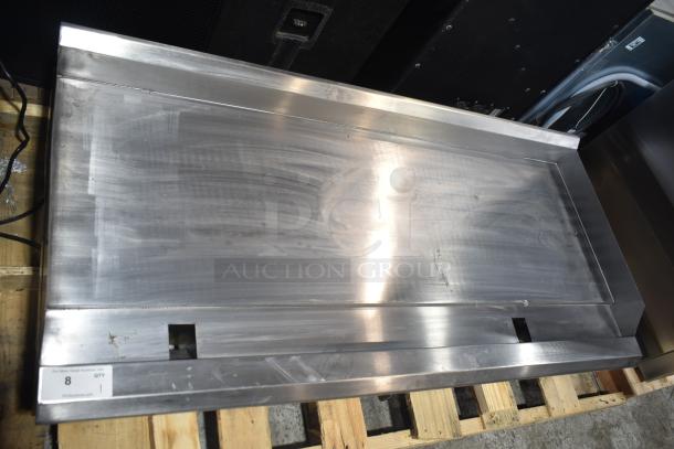 Brand new 2025 Avantco 177CAG60MG countertop flat top griddle, natural gas, stainless steel, with light scratches.