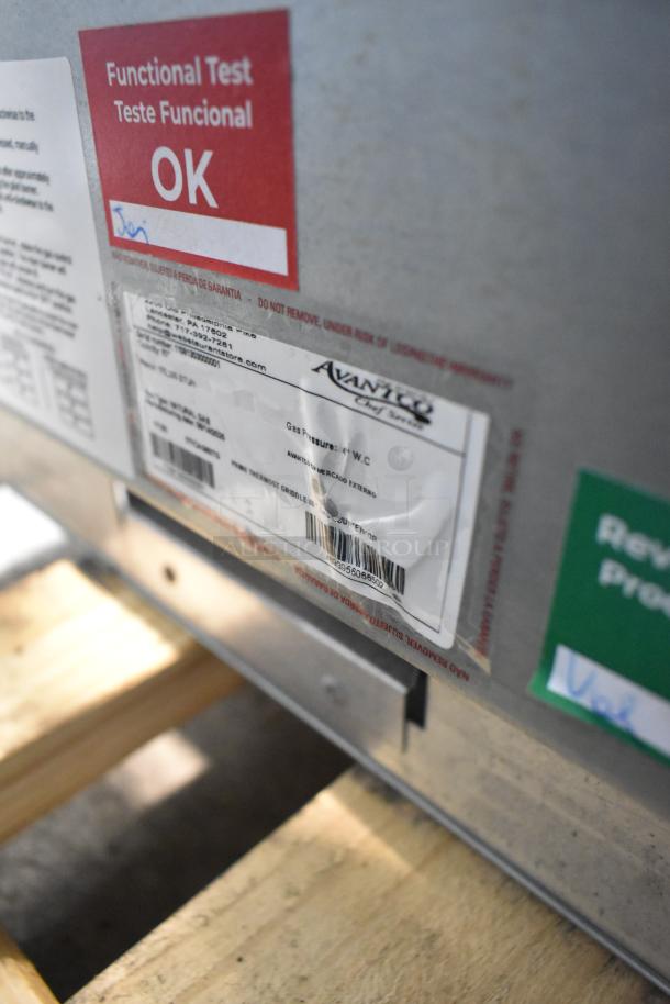 Avantco 177CAG60MG griddle, new, scratch and dent. Tag indicates functional test passed. Natural gas-powered.