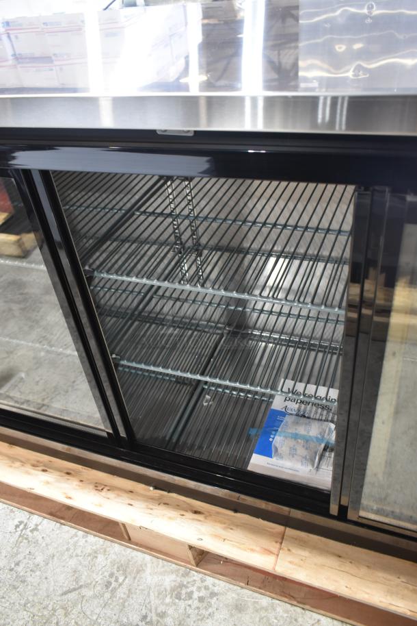 Brand new Avantco 178UBB72SHC 73" black bar refrigerator with narrow sliding glass doors and LED lighting, 115V, 1 phase.