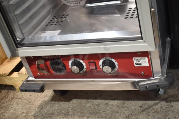 Avantco 177HPI1836 heated holding cabinet with clear door, controls for temperature and humidity, on commercial casters.