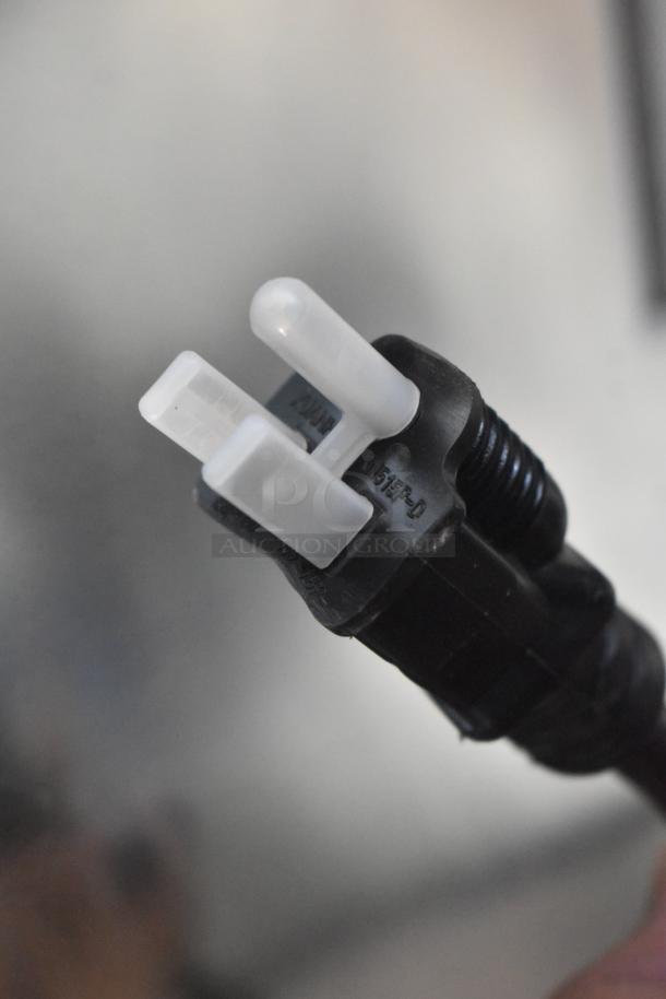 Close-up of a three-prong electrical plug for the Avantco 177HPI1836 heated cabinet, showing "120V" marking.