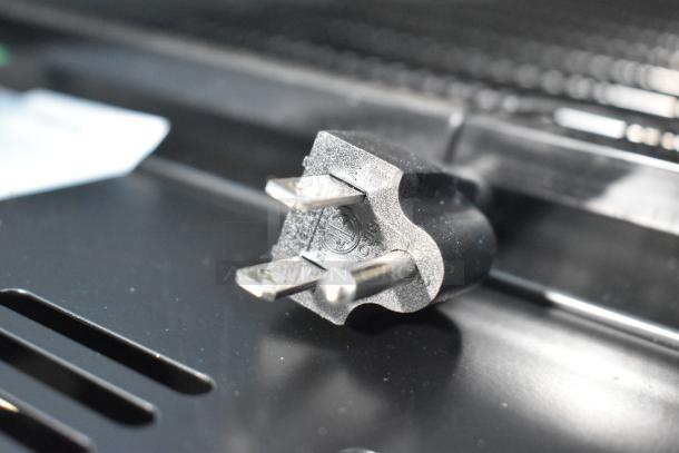 "Close-up of power plug for 2025 Avantco 360SC80 countertop merchandiser refrigerator. New condition, 115 volts, 1 phase."