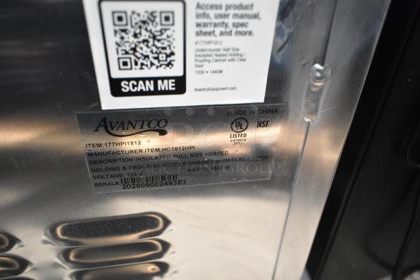 Alt Text: "Avantco 177HPI1812 insulated heated holding cabinet label showing model, voltage, and damage note on clear door."