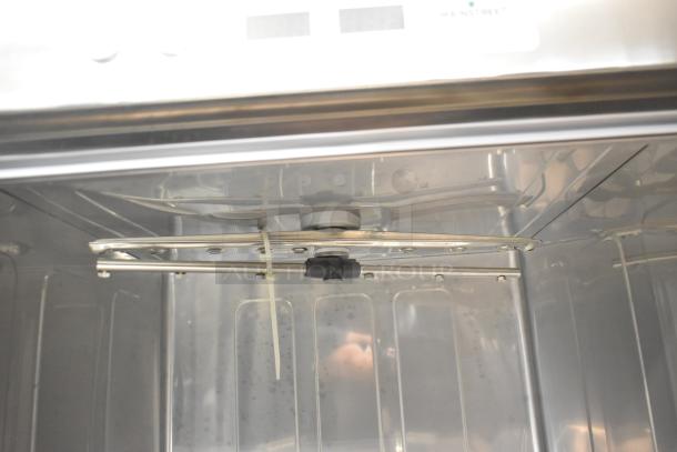 Alt text: Interior of a new 2024 Mainstreet 541HTUC30 commercial undercounter dishwasher showing stainless steel components.