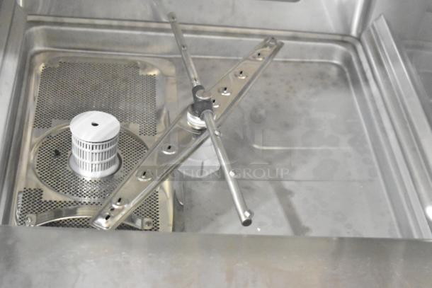 Mainstreet 541HTUC30 undercounter dishwasher interior detail, showing spray arm and filtration system, new condition.