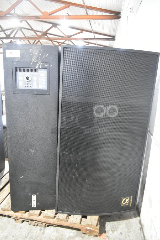 2 Dynacord Alpha X-1/60 loudspeakers on a pallet, black casing, visible connection panel, fair condition.