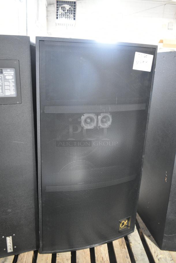 2 Dynacord Alpha X-1/60 loudspeakers, black, excellent condition, prominent front grille, visible brand logo, on pallets.