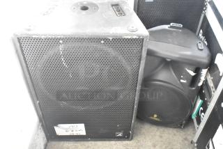 Yorkville TX4 and Eurolive B212A speakers, used, with visible wear, ideal for amplified sound setups.