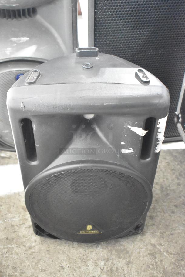 Yorkville TX4 and Eurolive B212A speakers, used, visible wear. Compact design, robust build. Behringer logo on Eurolive.