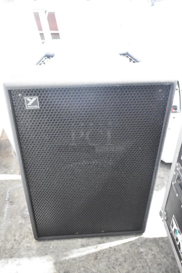 Yorkville TX4 speaker with black perforated grille, Yorkville logo. Part of a three-speaker auction lot.
