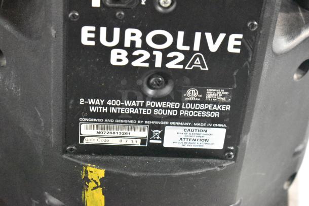 Eurolive B212A speaker, 2-way 400-watt, powered with integrated sound processor, Behringer design, visible caution label.