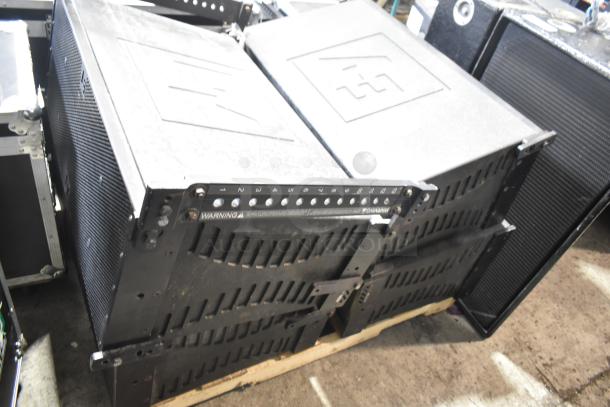 Four Electro-voice XLC127+ line-array speakers, 3-way, high-output, compact design, visible warning label. Good condition.