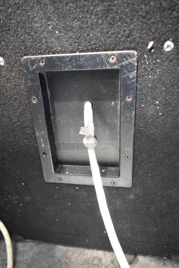 Close-up of a Yorkville speaker input panel with cable connected, showcasing condition and connectivity features.