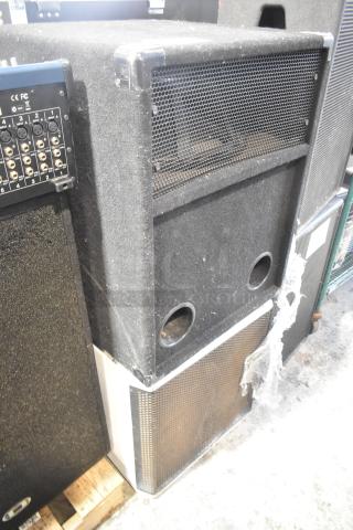 Two speakers, including JBL MRX500 loudspeaker and Electro-Voice S-181 subwoofer. Visible ports and connection panel. Signs of use.