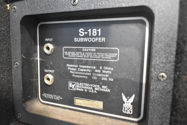 Electro-voice S-181 Subwoofer panel showing input/output jacks, caution label, 8 Ohms, 400W power capacity, and serial number.