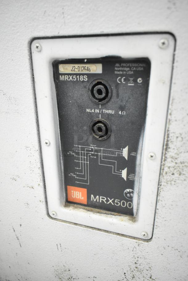 JBL MRX500 speaker label with connectors and wiring diagram. Shows NL4 inputs, 4Ω resistance, model MRX518S.